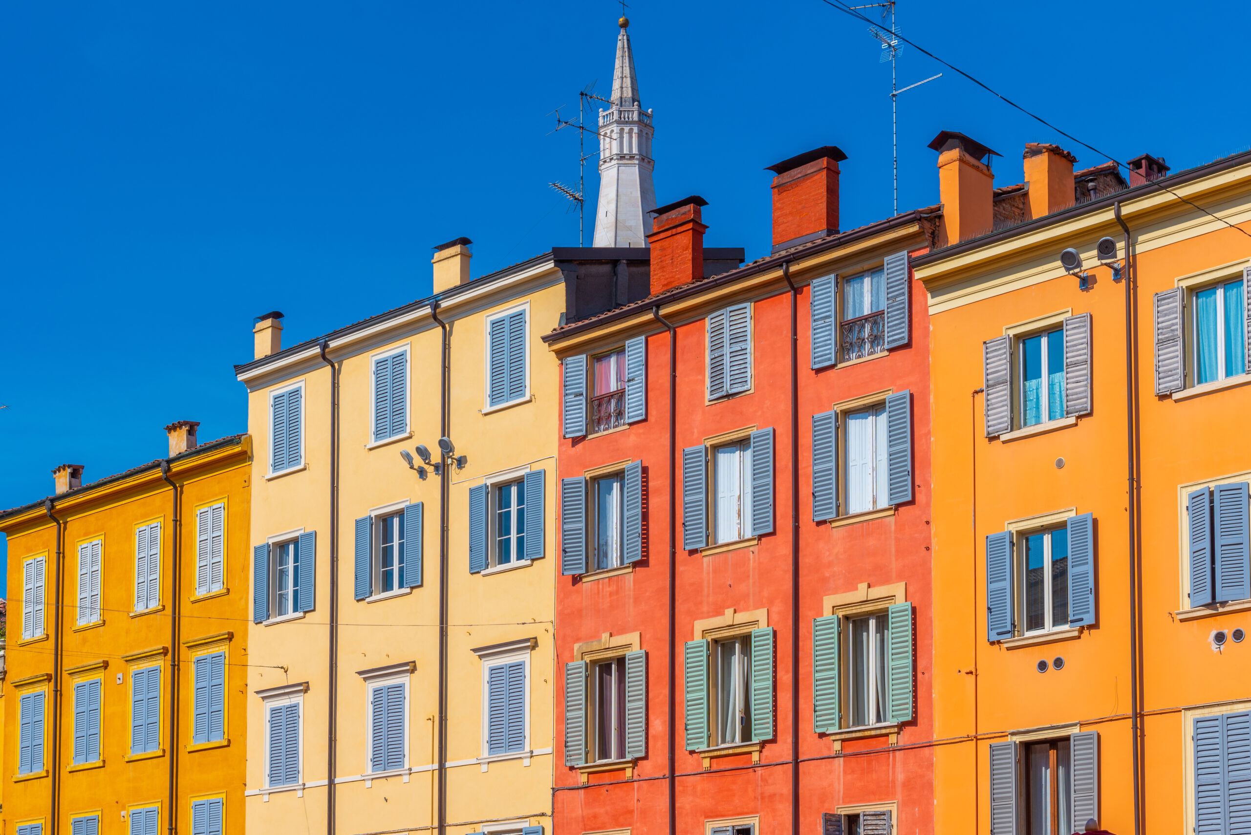Colorful facades of historical building in Italian town Modena.